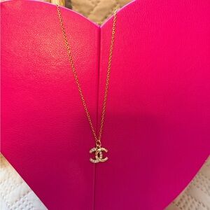 Upcycled Chanel charm on a necklace